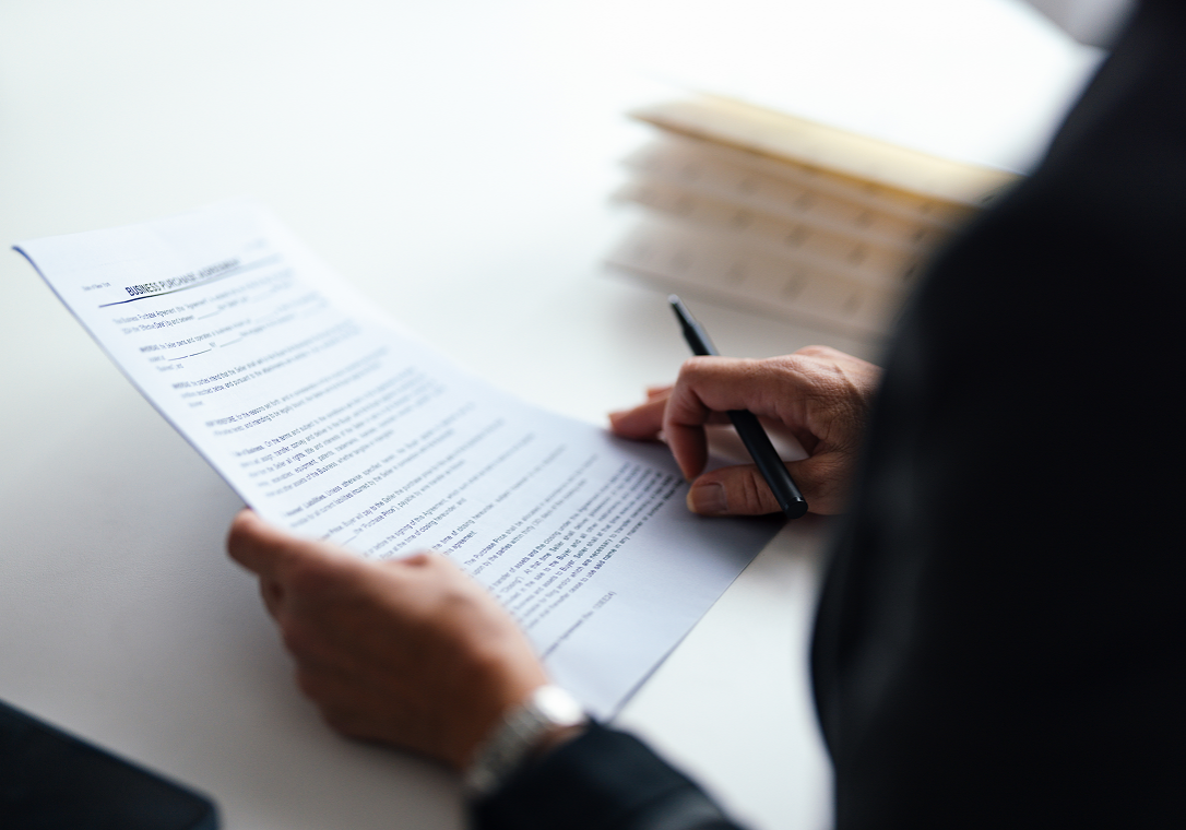 Reviewing paperwork at a desk